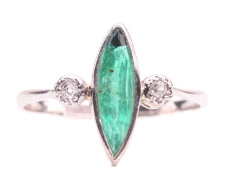 An emerald and diamond ring, set with a marquise shape emerald measuring 13.4mm x 3.7mm, between single cut diamonds with a t