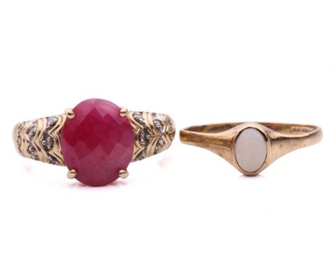 A ruby ring and an opal ring; the ruby ring set with a central fancy cut ruby in a claw setting between scalloped shoulders s