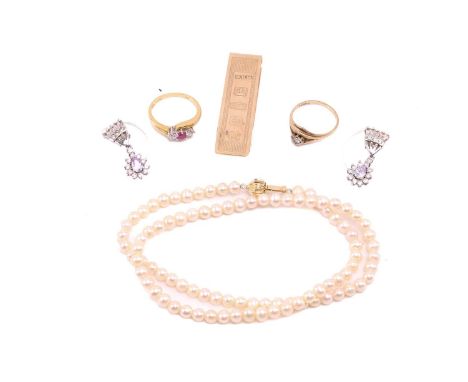 Assorted jewellery items including a 9ct yellow money clip, a synthetic ruby and diamond three-stone ring in 18ct gold, a CZ 