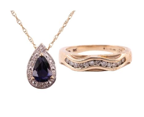 An iolite and diamond drop shape pendant, the central pear shape iolite measuring 7.8mm x 5.6mm, with hallmarks for 9ct gold,