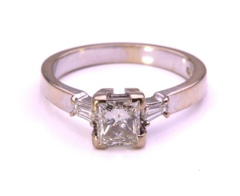 A princess-cut diamond solitaire ring in 9ct white gold, comprising a rectangular princess-cut fractured filled diamond with 
