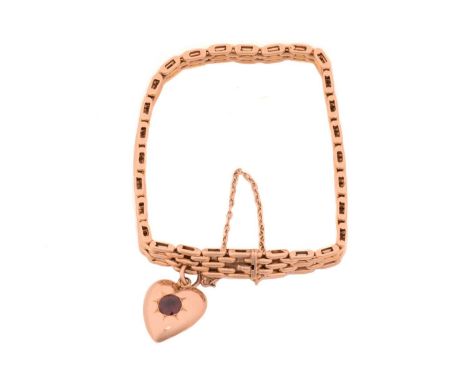 A panther link bracelet with garnet-set charm, comprising a five-row panther link chain fastened with a concealed tongue clas