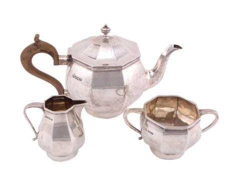 A 20th century silver bachelor's three-piece tea set, by Thomas Bradbury &amp; sons, Sheffield 1938/39, of squate octangonal 