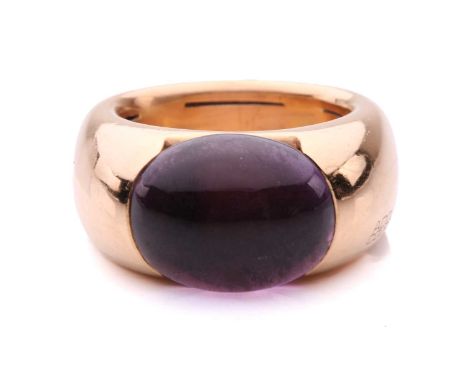 An amethyst cocktail ring by Adolfo Courrier, centred with an oval amethyst cabochon in a closed-back mount, approximately me