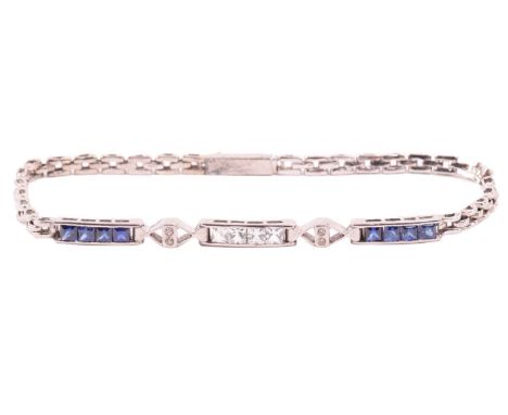 A sapphire, white sapphire and diamond line bracelet, with segments of French-cut blue sapphires in channel setting, flanking