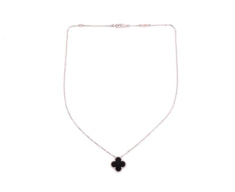 Van Cleef &amp; Arpels - an 18ct white gold and onyx 'Alhambra' pendant on chain, comprising the iconic quatrefoil motif in 1