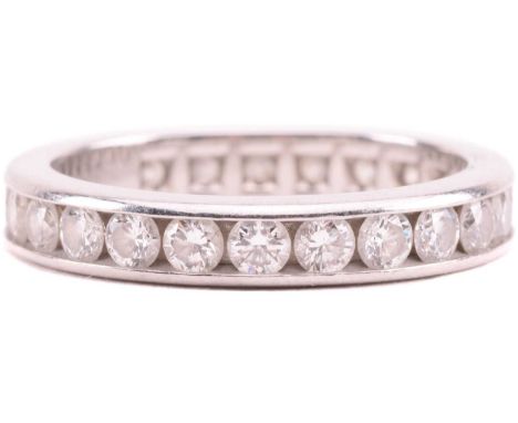 A Tiffany and Co. diamond eternity ring, set with round brilliant cut diamonds in a channel setting around the full circumfer