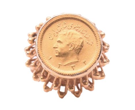 A Persian coin inset signet ring, mounted with a ¼ Pahlavī 1332 (1953) coin to a wirework basket with bead embellishments, an