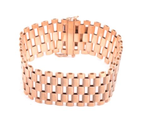A five-row panther link bracelet in 9ct yellow gold, completed with a concealed tongue clasp and double figure-of-eight catch