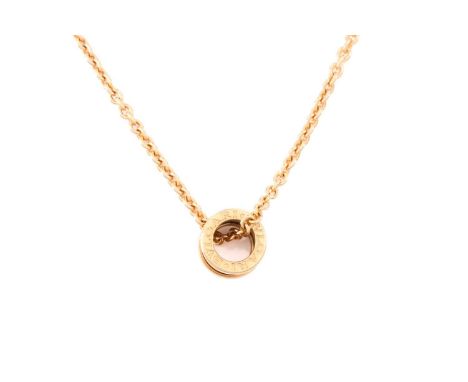 Bulgari - a B.zero1 pendant on 18ct yellow gold chain, of spring design, flat edges signed with brand name, stamped with Ital