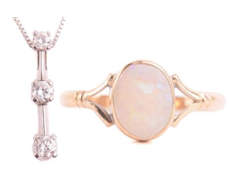 An opal dress ring in 9ct gold and a diamond pendant on chain; the ring contains an oval cabochon of precious opal in collet,