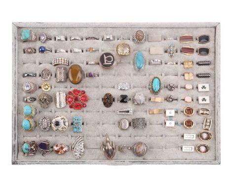 A large collection of cufflinks and costume rings; to include examples of a pair of 9 carat gold and enamel cufflinks, the re