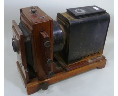 A 19TH CENTURY MAHOGANY AND TIN PLATE PROJECTOR, 40cm high 