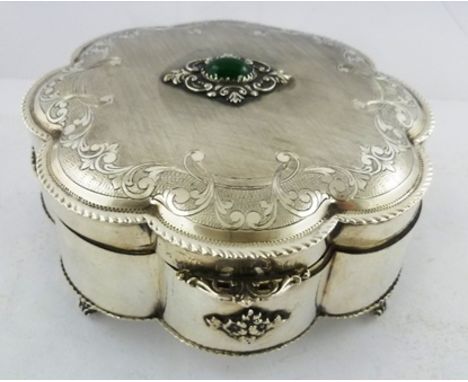 AN EARLY 20TH CENTURY SWEDISH SILVER COLOURED METAL LADY'S DRESSING TABLE BOX having hinged lid set cabochon jade, on a toole