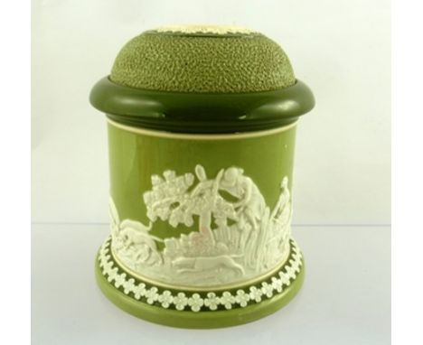 A CARLTON WARE BAR TOP MATCH HOLDER AND STRIKER, green glazed with moulded white cameo hunting scene in the round, 14cm high 