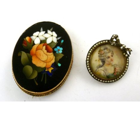 A VICTORIAN PIETRA DURA BROOCH, the coloured stones depicting flowers on a slate ground, pin mount, 5cm x 3.5cm, together wit