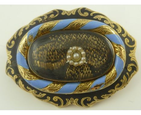 A VICTORIAN GOLD AND ENAMEL MOURNING BROOCH, centre set with seed pearl flower, black and blue surround "In Memory of Joseph 