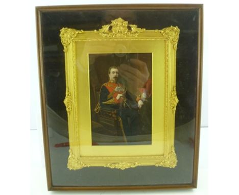 A VICTORIAN HAND COLOURED AND GILDED PHOTOGRAPHIC PORTRAIT of an Officer of the 5th Lancers, in an ornate gilt frame, enclose