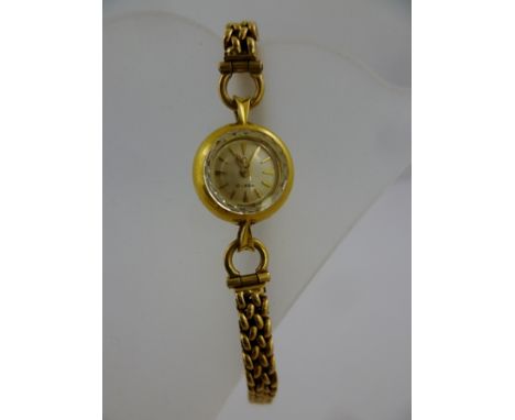 A 1960's OMEGA LADY'S COCKTAIL WATCH, back winder, baton dial, possibly 18ct gold case and possibly 9ct gold flexible bracele