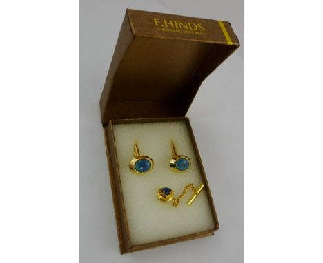 A SET OF OVAL OPAL BAR CUFFLINKS, together with a TIE TACK SET with a black fire opal, all in gilt metal settings (originally