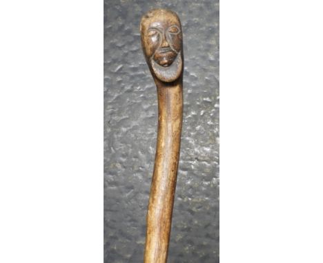 COUNTRY WALKING STICK WITH CARVED FACE TO HANDLE 