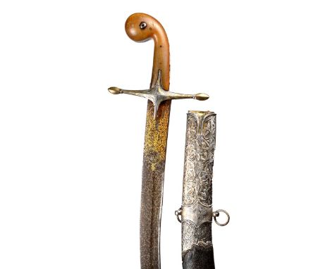 λ A fine Turkish sword (kilij), watered steel blade 28.5 in., the yelman 12 in. with gold damascene to a raised panel, shallo