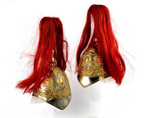 Two wall lights adapted from Blues and Royals other ranks parade helmets, each fitted with a bracket to the rear and a bulp h