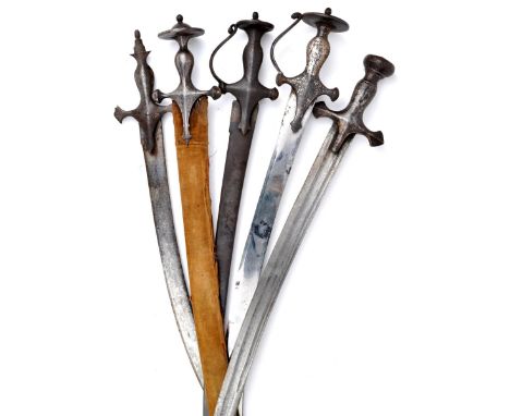 A group of five Asian swords, comprising: four Indian tulwar, with curved blades and characteristic Indo-Muslim hilts (one pa