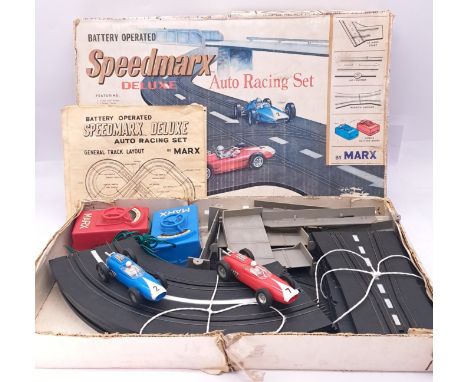 Marx, a boxed vintage early issue slot car racing set "Speedmarx Deluxe Auto Racing Set which comes complete with 2x Slot Car