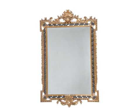 A carved gilt and ebonised framed wall mirror in George II style, late 20th century, by Harrison & Gil, in the manner of Will