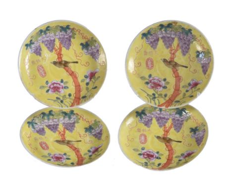 A set of four dayazhai-style saucers, Republic period, decorated in the interior with a bird perched on a tree entwined with 