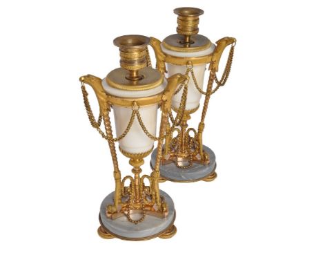 A pair of late Louis XVI white and dove grey marble and ormolu mounted candlesticks, circa 1790 and later adapted, each with 