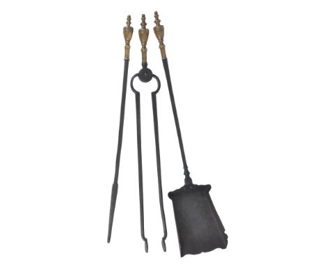 A set of George III wrought iron and brass mounted fire tools, early 19th century, comprising shovel, poker and tongs, with k