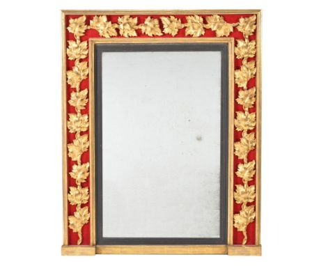 A Regency giltwood and composition wall mirror, circa 1815, the surround with inset band of vine leaves on a red velvet groun