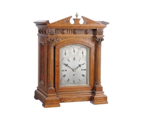 A Victorian carved oak quarter chiming bracket clock, Unsigned, late 19th century, the substantial four pillar triple chain f