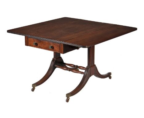 A Regency mahogany Pembroke or sofa table, circa 1820, with frieze drawer to one short end and opposing false drawer, on reed