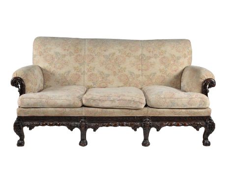 A carved mahogany and upholstered sofa, late 19th/early 20th century, 104cm high, 212cm wide, 86cm deep