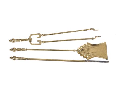 An early Victorian set of cast and engraved brass fire tools, circa 1840, in Rococo Revival taste, comprising shovel, poker a