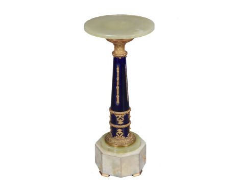 A French green onyx, gilt metal and blue glazed ceramic mounted pedestal, 20th century, the circular top above a tapering and