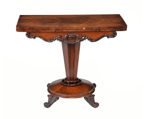 ϒA William IV rosewood card table, circa 1835, the top enclosing a circular playing surface, on facetted pillar, circular bas