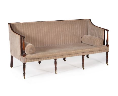 A George III mahogany sofa, circa 1800, the rectangular padded back and downswept arms framed by reed moulded detail, the loo