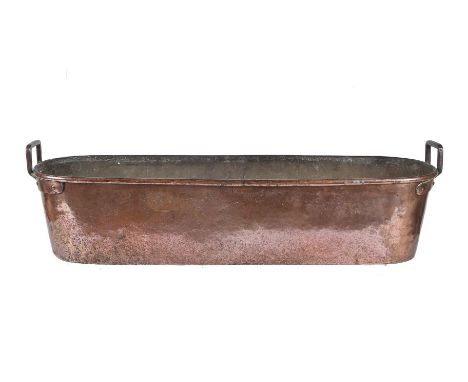 A substantial French copper and wrought iron mounted fish kettle or poissonnière, probably first half 19th century, the elong