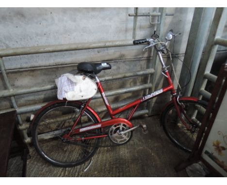 A vintage Triumph traffic master push bike