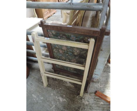 A tapestry fire screen and vintage clothes maid