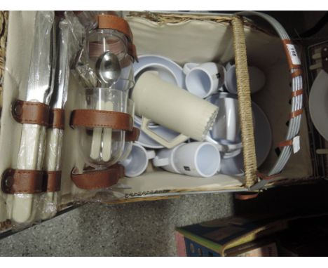 A picnic hamper and contents