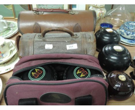 Three sets of cased vintage crown green type bowls and uncased set