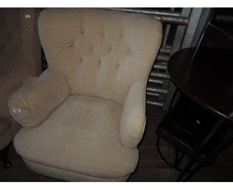 A modern button back armchair