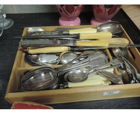 A vintage cutlery tray and contents