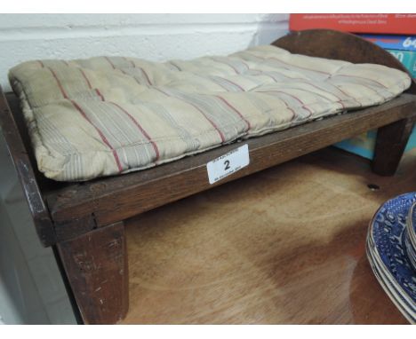 A vintage childs toy bed