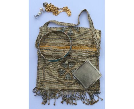 A stylish silver bead work purse together with a silver and enamel bangle etc. Est. £15 - £20.